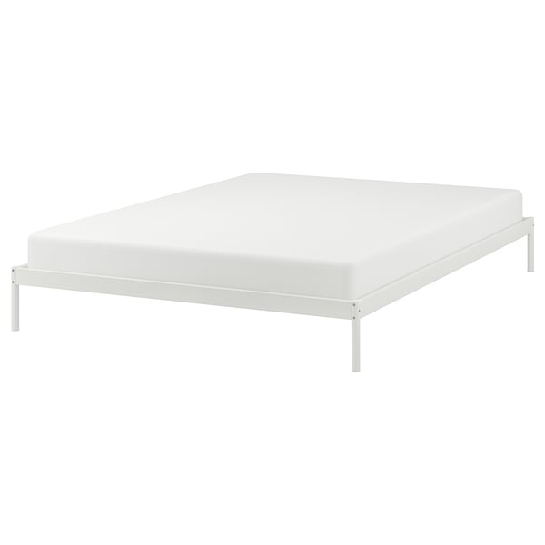 White VEVELSTAD bed frame with slim metal legs and simple design.