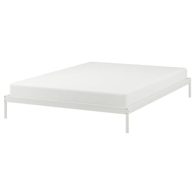 White VEVELSTAD bed frame with slim metal legs and simple design.