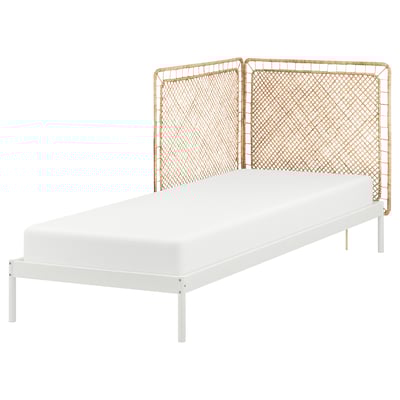 VEVELSTAD bed: white metal frame, natural rattan headboard, modern, sleek design.