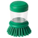 Green washing-up brush with liquid reservoir and silicone valve.
