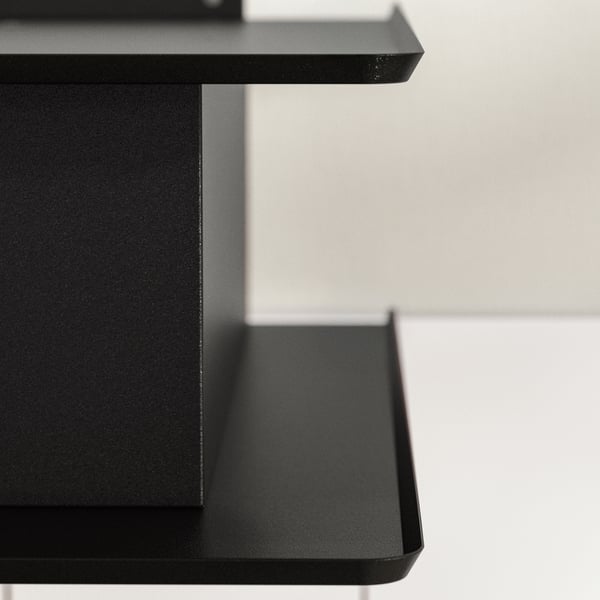 Black modern kitchen hood with sleek shelves, perfect for small spaces.