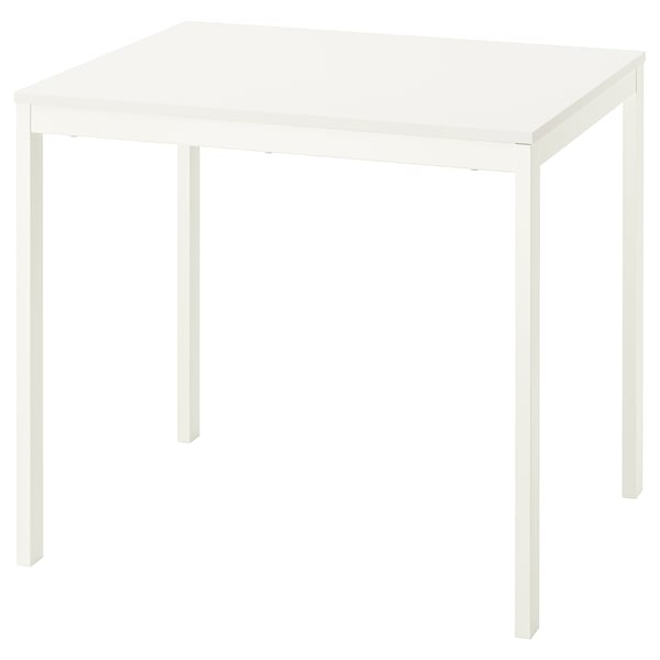 White IKEA VIHALS extendable dining table with metal legs.