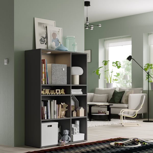 Grey VIHALS storage unit in living room with mixed storage and cable management.