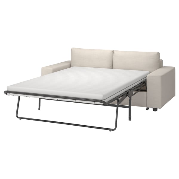 The VIMLE sofa-bed in beige, featuring a metal frame and thick mattress, offers comfortable seating and sleeping.