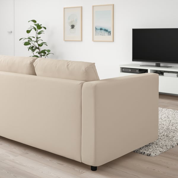 Beige VIMLE sofa in living room with tv and artwork.