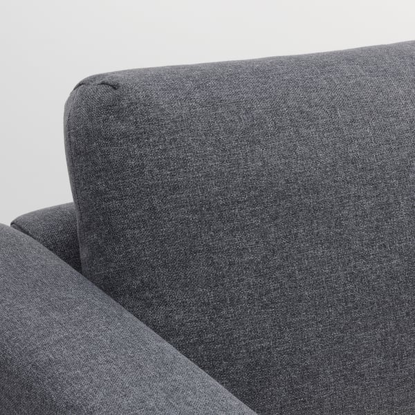 Close-up of dark VIMLE sofas arm and back. Soft, durable fabric with clean lines.