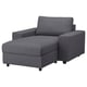 Modern grey fabric sofa with a chaise lounge, squared arms, and black legs.