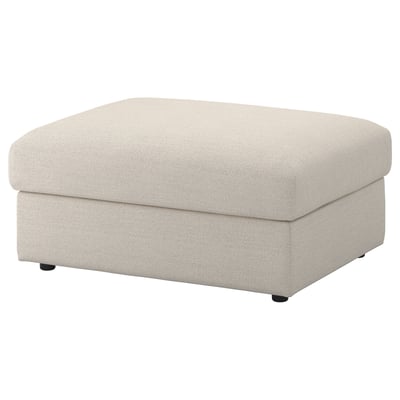 A VIMLE footstool in beige colour with storage. It has a square shape, soft fabric, and minimalist design.