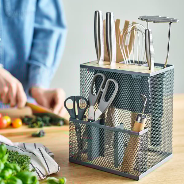 Bamboo-topped mesh knife holder for accessible kitchen storage.