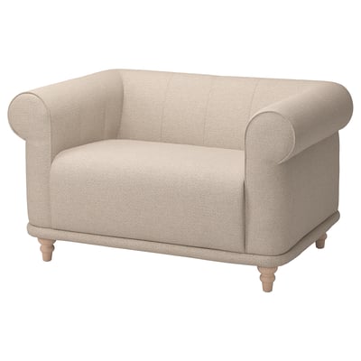 This image a VISKAFORS armchair, upholstered in beige fabric with rolled arms, a deep seat, and wooden legs.