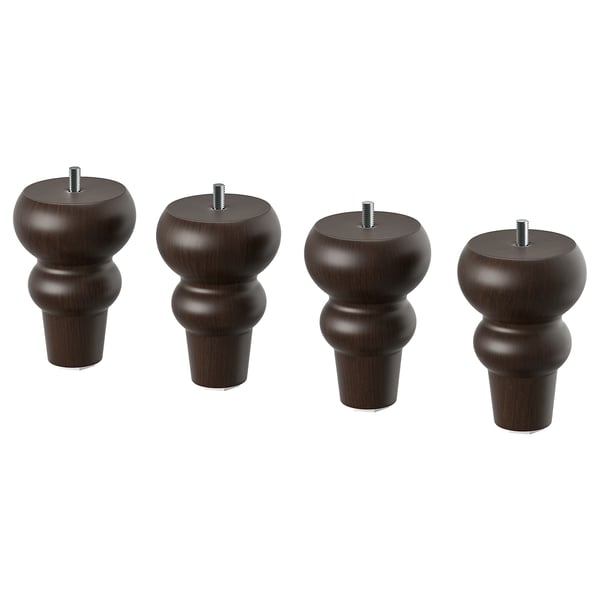 Four dark brown, curved, wooden furniture legs with screws on top.