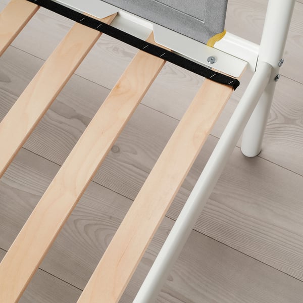 This image shows a bunk beds ladder and slatted base, highlighting its sturdy yet simple design.