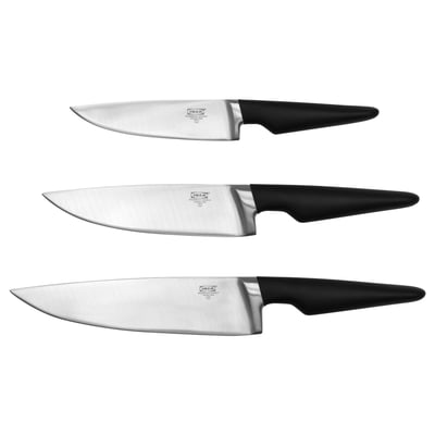 Three VÖRDA knives with black handles, stainless blades, and ergonomic design displayed vertically.