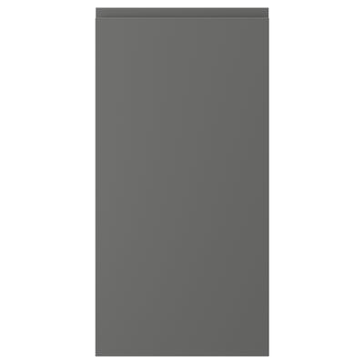 A grey, rectangular cabinet door with a smooth, minimalist design. It integrated handles and is part of the VOXTORP series.