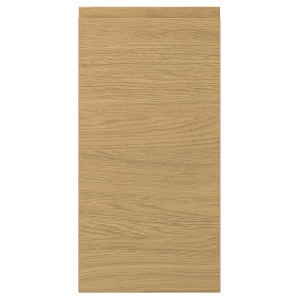 A VOXTORP door front. It is rectangular, in an oak colour, with a smooth finish and integrated handles.