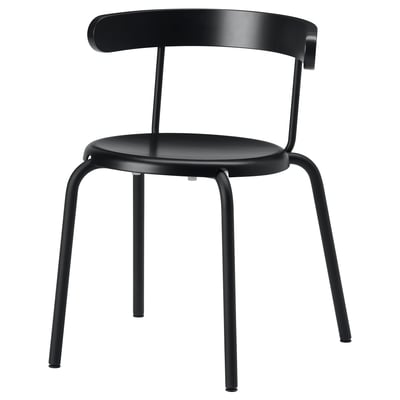 A black YNGVAR chair with a curved back, beech veneer seat, and metal legs. The design is minimalist and modern.