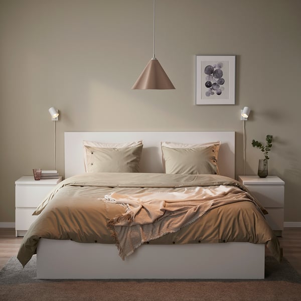 Bedroom with ZEBRASÄV lamp, asymmetrical, over bed, tan, neutral decor, materials & shapes, plant & art.