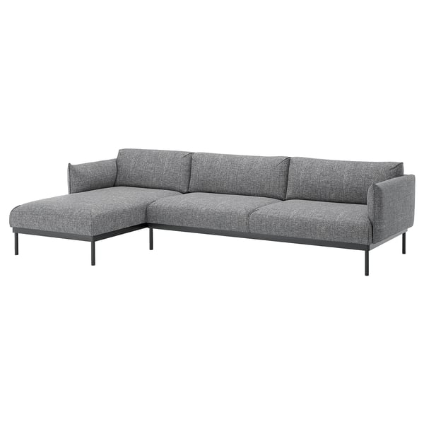 Moderni pilka L formos sofa su aptakiomis metalinėmis kojomis, jaukiomis pagalvėlėmis ir stilingu, minimalistiniu dizainu.
