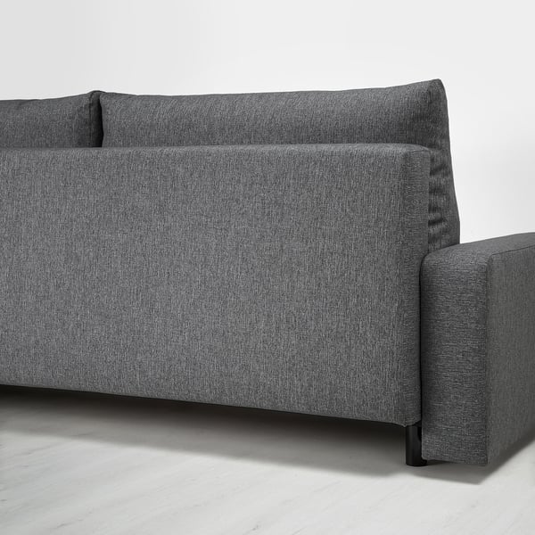 Pilko audinio sofa-lova su daiktadėže po sėdyne.