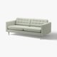 Šviesiai pilka, moderni minkšta sofa su sagomis ir plonomis metalinėmis kojelėmis. Jis turi minimalistinį dizainą.