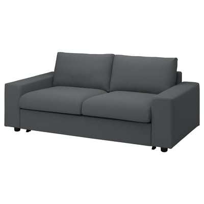 Pilka VIMLE 2 vietų sofa-lova su švariomis linijomis ir pliušinėmis pagalvėlėmis.