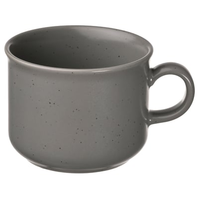 Круглая кружка из серого керамогранита с крапчатым рисунком и ручкой.