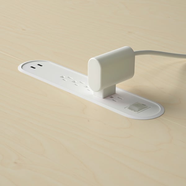 Белая настольная вставка с двумя USB-портами и розеткой.