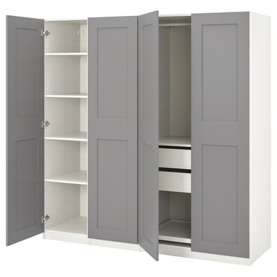 Серый шкаф ikea PAX с открытыми дверцами, открывающимися полками и ящиками внутри.