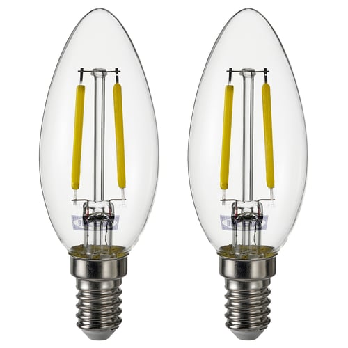 Две тепло-белые светодиодные лампочки с прозрачными стеклянными крышками и серебристыми цоколями, расположенные рядом.