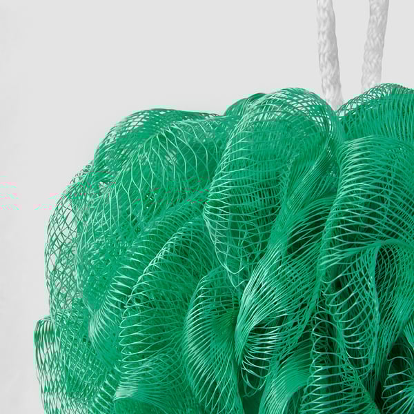 Three green mesh loofahs hang by white ropes, offering exfoliation and foam enhancement.