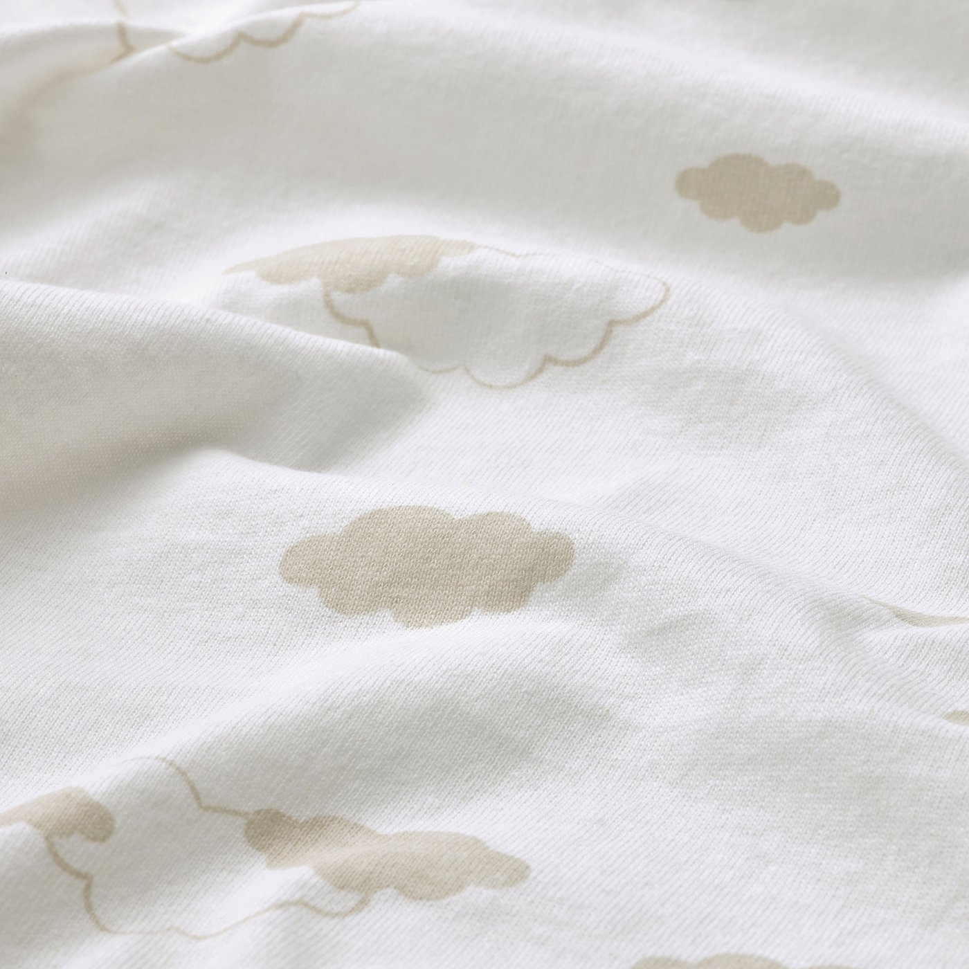 Soft cotton sheet with puffy cloud patterns.