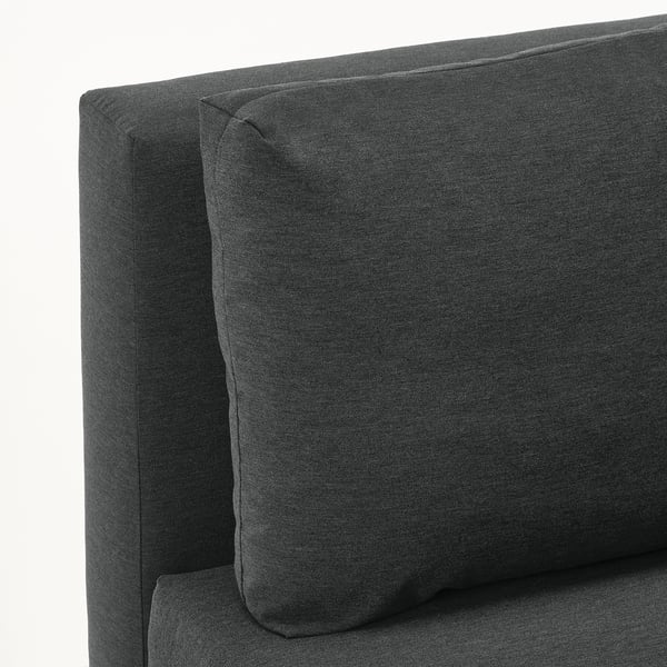 Dark grey sofa with folded-out backrest, showcasing quality fabric and cushion detail.