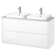 Modern white dual sink vanity with sleek handles, marble basin, chrome faucets.