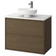 Modern bathroom unit: oval sink, oak cabinet, wall-mounted, sleek handles.
