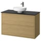 Modern oak vanity with black countertop, round white basin, sleek design.