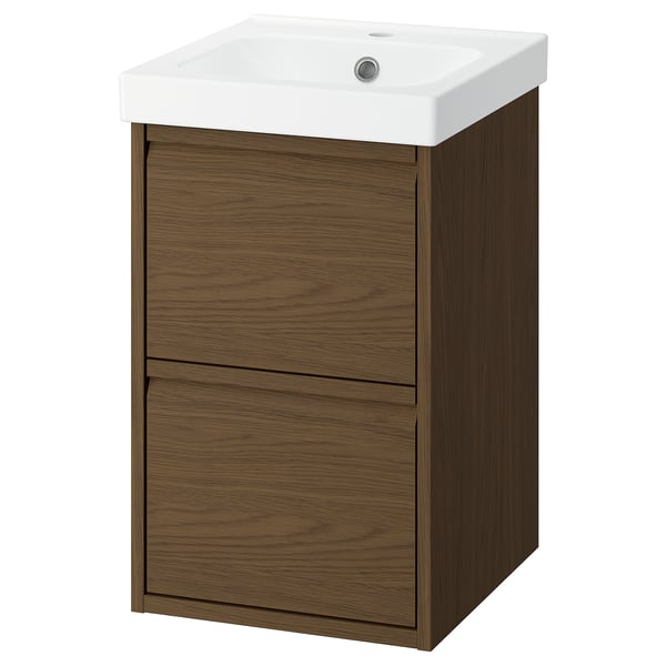 An ÄNGSJÖN brown oak effect bathroom vanity with a white ceramic basin, featuring two spacious drawers, and minimalist design.