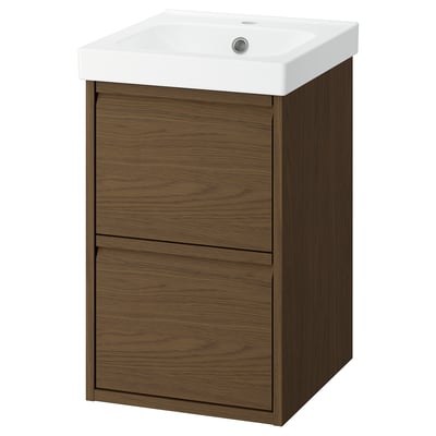 An ÄNGSJÖN brown oak effect bathroom vanity with a white ceramic basin, featuring two spacious drawers, and minimalist design.
