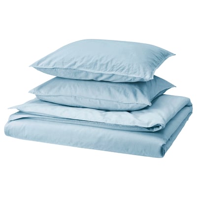 A stack of light blue ÄNGSLILJA bed linens, including a duvet cover and two pillowcases, made of soft pre-washed cotton.