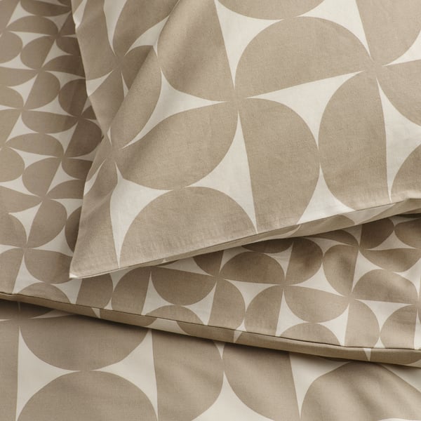 Close-up of modern geometric fabric with circles and lines. Soft, crisp texture, showcasing high-quality cotton and viscose blend.