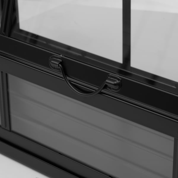 Close-up of modern greenhouse handle; sleek black design, robust and stylish.