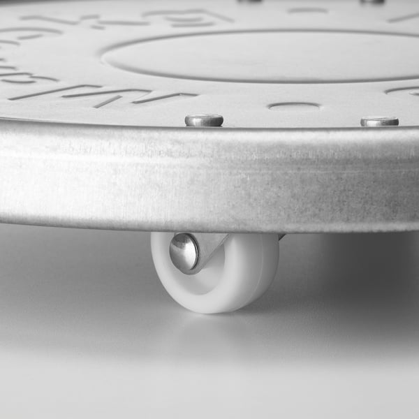 Close-up of galvanised steel plant mover wheel, showcasing quality and design.