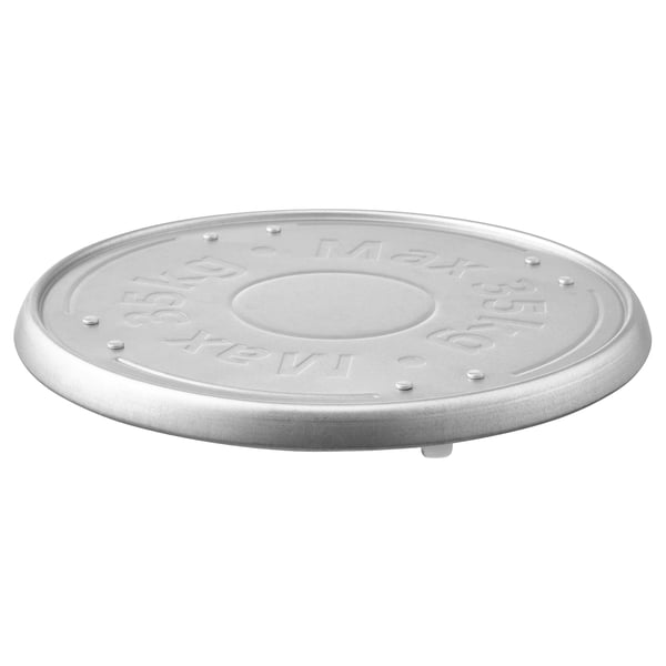 Silver circular galvanised steel plant mover with raised text and design, featuring embossed circle in centre.