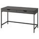 Modern black ALEX desk with slim metal legs, rectangular top, and two drawers for sleek storage.
