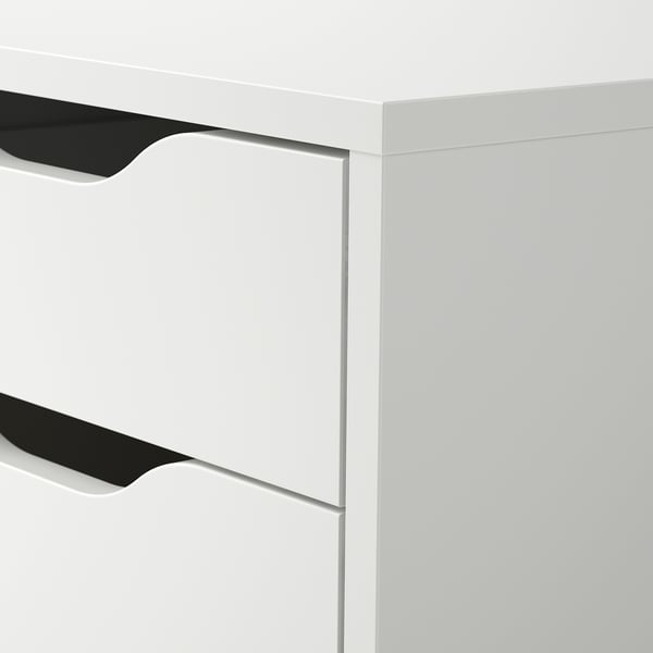 Close-up of ALEX drawer unit. Sleek, white, with modern black handles, showcasing high-quality finish and design.