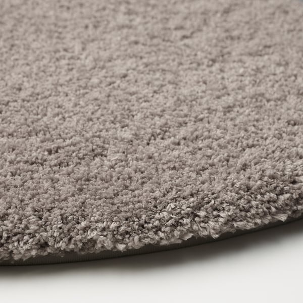 Soft, plush, grey bath mat with textured microfibre surface and non-slip backing.