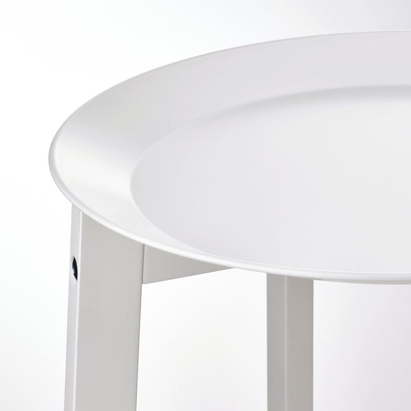 White round plant stand with smooth powder-coated tray, supported by sturdy wooden legs.