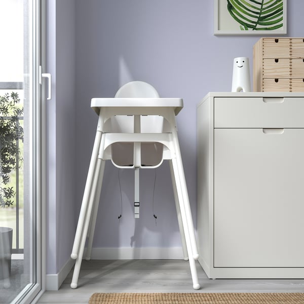 White highchair with removable tray and legs for easy portability. Suitable for children up to 3 years or 15 kg.