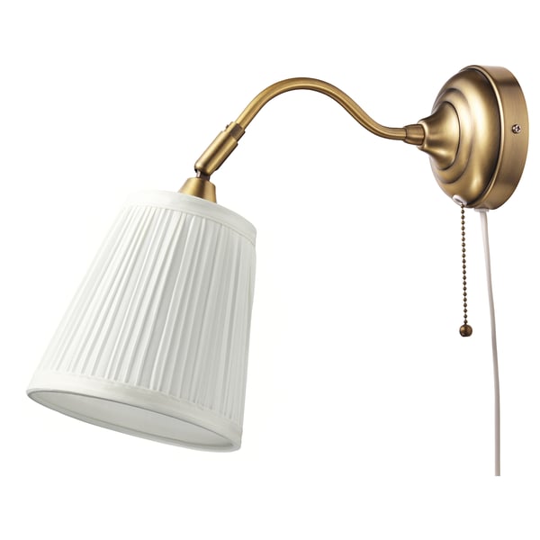 A gold-colored ÅRSTID wall lamp with a white, ribbed shade and a pull chain.