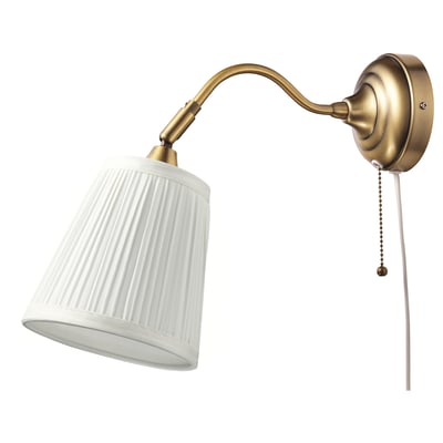 A gold-colored ÅRSTID wall lamp with a white, ribbed shade and a pull chain.