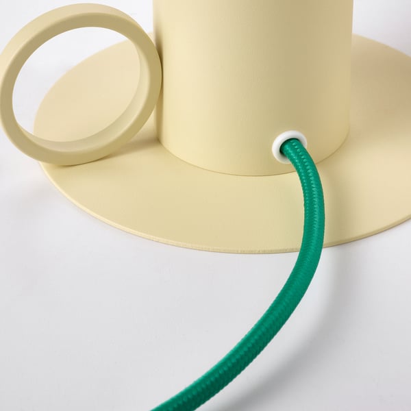 Modern pastel lamp with green flexible cord. Soft, adjustable light. Quality design.